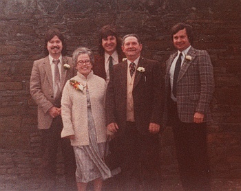 Mom and Dad
                with their 3 grown sons.