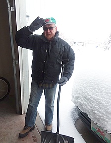 John with
                snow shovel and deep snow.