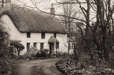 Old stone cottage with a thatched roof