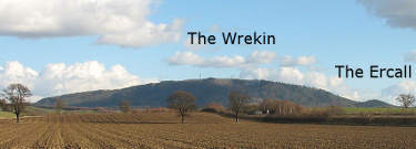Photo of The Wrekin
                and The Ercall (two hills in the distance).